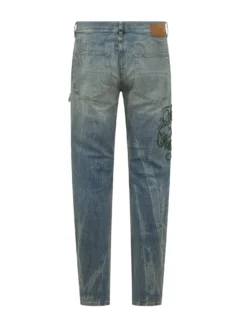 Jeans Slim Con Strappi E Ricami